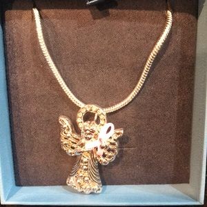 Fashion Jewelry- breast cancer angel pendant doubles as a charm or pin.